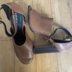 Coach Lucille Sandal. 4 1/2” heels. Gently worn. See pictures for slight scuffs.